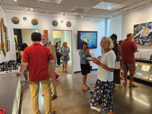 Guests at ARTclectic Gallery's opening reception for "Action and Abstraction" art exhibit
